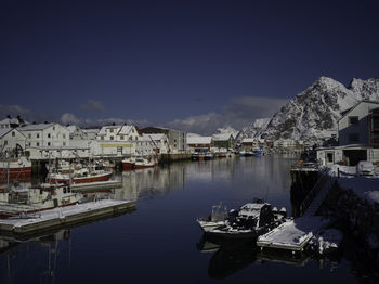 Boats moored at harbor