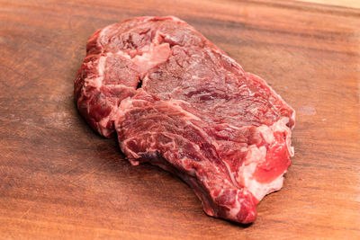 High angle view of meat on cutting board