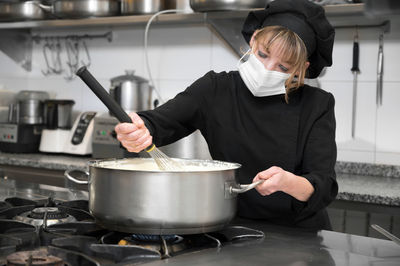 Young man preparing food at home