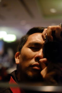 Close-up portrait of young man looking away