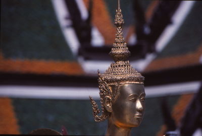 Close-up of metallic sculpture at temple