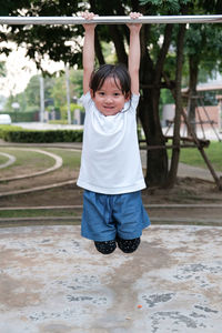 Portrait of happy girl playing in park