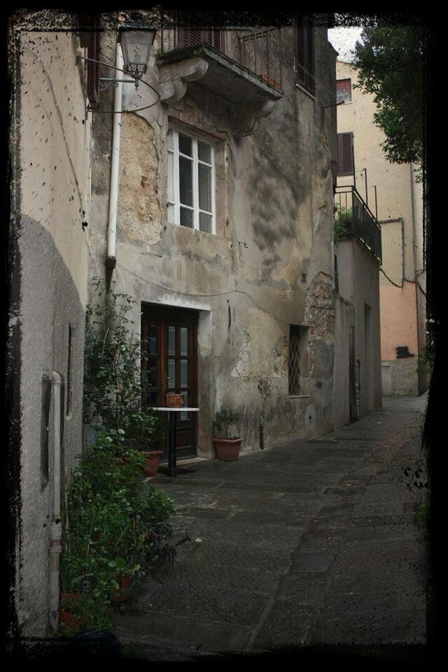 architecture, building exterior, built structure, transfer print, house, residential building, residential structure, window, auto post production filter, street, building, the way forward, door, day, city, wall - building feature, outdoors, cobblestone, wall, no people