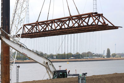 Bridge over river against sky