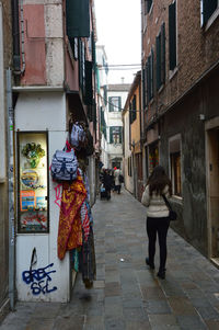 People walking on sidewalk in city