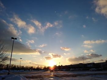 Street against sky during sunset