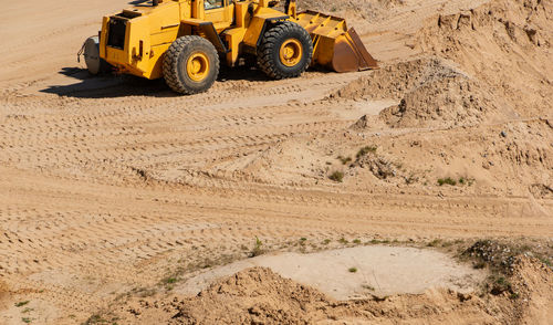 Gravel quarrying in a gravel pit during a drone flight