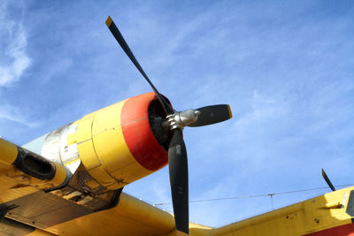 Low angle view of airplane against sky