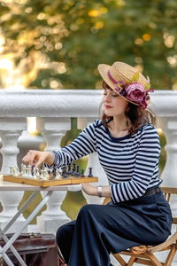Rear view of woman looking at outdoor cafe