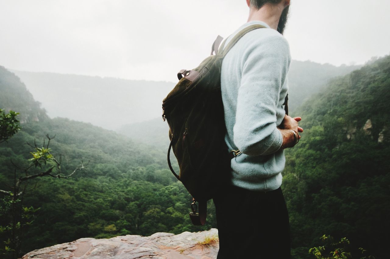 tree, mountain, plant, real people, leisure activity, standing, scenics - nature, one person, nature, fog, non-urban scene, day, beauty in nature, activity, tranquility, lifestyles, environment, mountain range, tranquil scene, outdoors