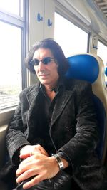 Young man sitting in bus