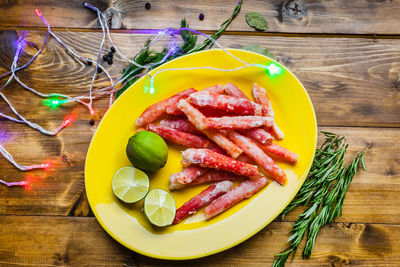 High angle view of fruits in plate on table