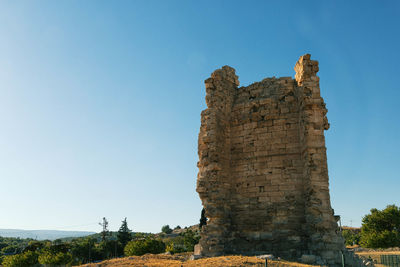 Low angle view of old ruins against clear sky