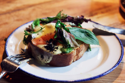 Close-up of breakfast served in plate on table