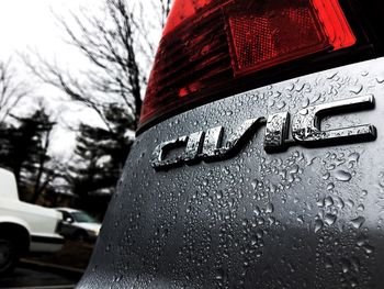 Close-up of red car against sky