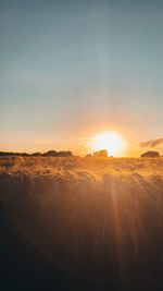 Scenic view of landscape against sky during sunset