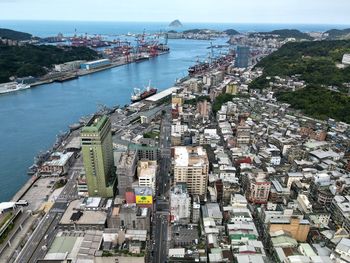 High angle view of cityscape by sea