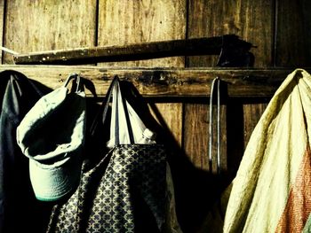 Close-up of clothes drying on wood