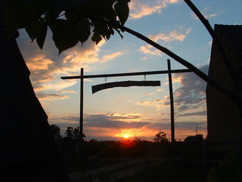 Silhouette trees against sky during sunset