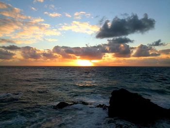 Scenic view of sea against sky during sunset