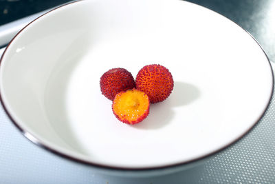 High angle view of strawberries in plate on table