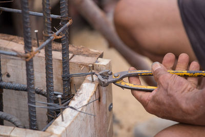 Close-up of man working at construction site