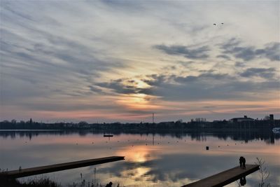 Scenic view of lake against sky during sunset