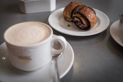 Close-up of coffee cup on table