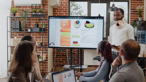 Businessman giving presentation in meeting