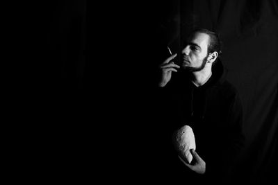 Portrait of mature man smoking