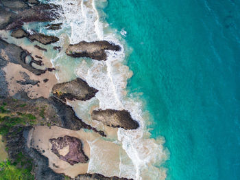 High angle view of rocks on beach