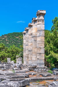 Old ruin building against blue sky