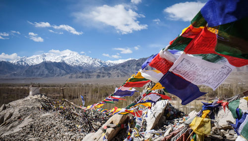 Traditional tibet flags against mountains during winter 