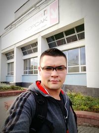 Portrait of young man standing outdoors