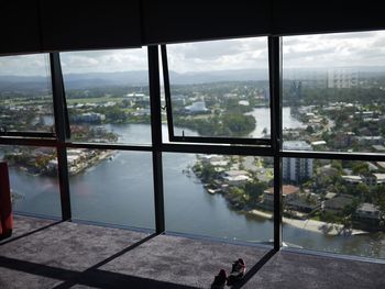 City and river seen from window glass