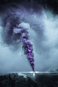 Smoke emitting from purple sky