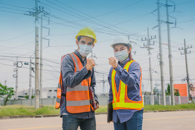 Man working on electricity pylon