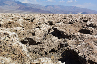 Scenic view of barren landscape against sky in death valley 