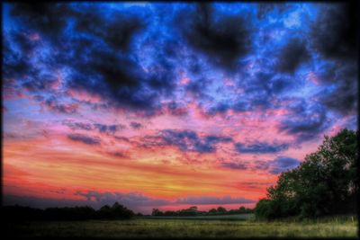 Scenic view of landscape against cloudy sky