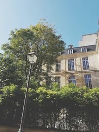 Low angle view of built structure against trees