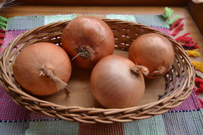 High angle view of pumpkins in basket on table