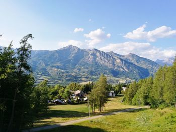 Scenic view of landscape and mountains against sky