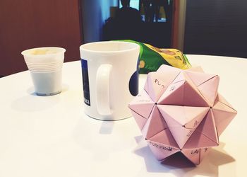 Close-up of coffee cup on table