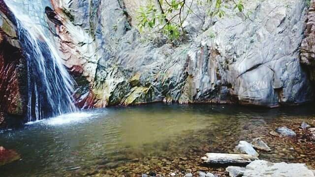 water, rock - object, tranquil scene, scenics, tranquility, beauty in nature, rock formation, stream, nature, stone - object, non-urban scene, flowing, idyllic, cliff, eroded, geology, river, natural landmark, rock, majestic, day, rocky mountains, remote, pebble, branch, physical geography, tourism, stone