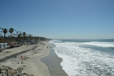Scenic view of beach against clear sky
