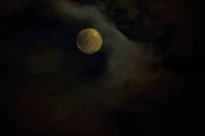 Scenic view of moon against cloudy sky