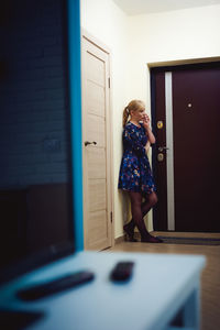 Boy standing at home