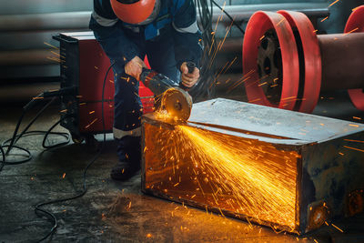 People working on metal structure