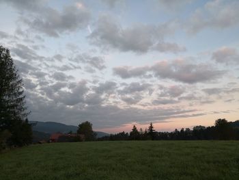 Scenic view of field against sky during sunset