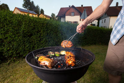 Midsection of man preparing food